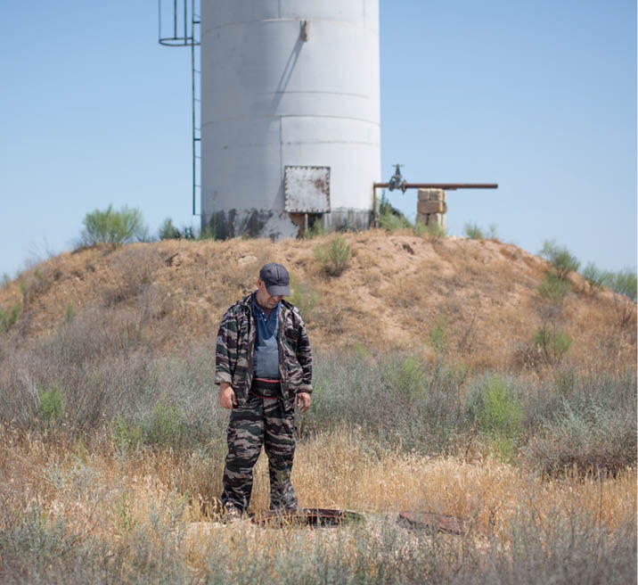 Mohammed checks water level in Artezian.