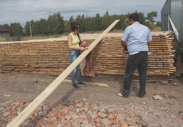 Anya buying wood for a restoration