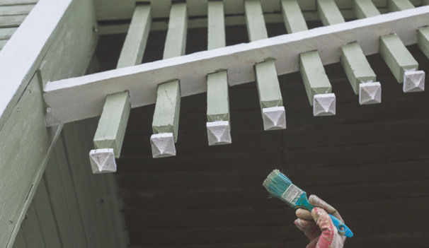 Hand holding paintbrush