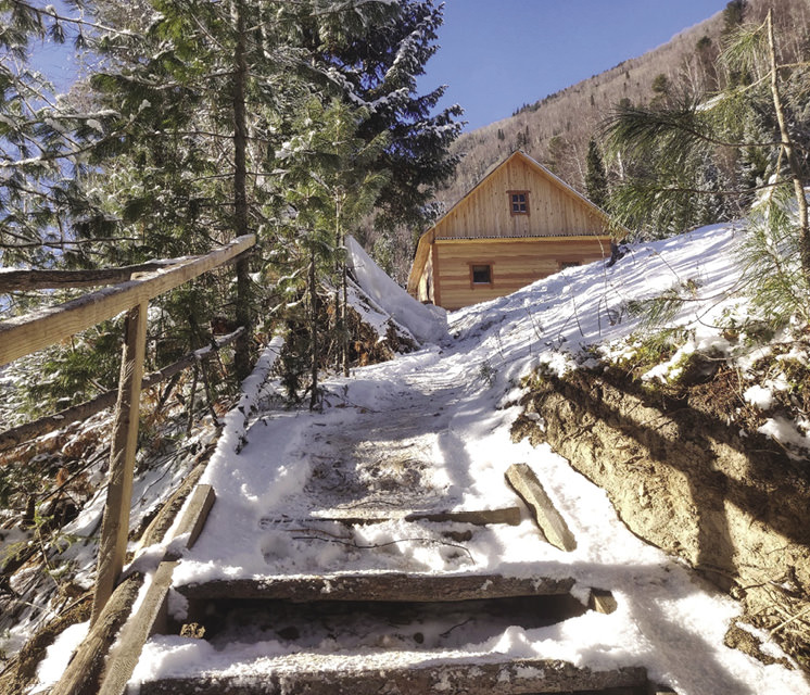 Wooden hut in taiga.