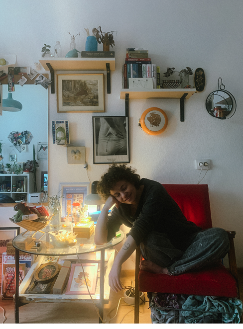Woman sitting in her apartment.