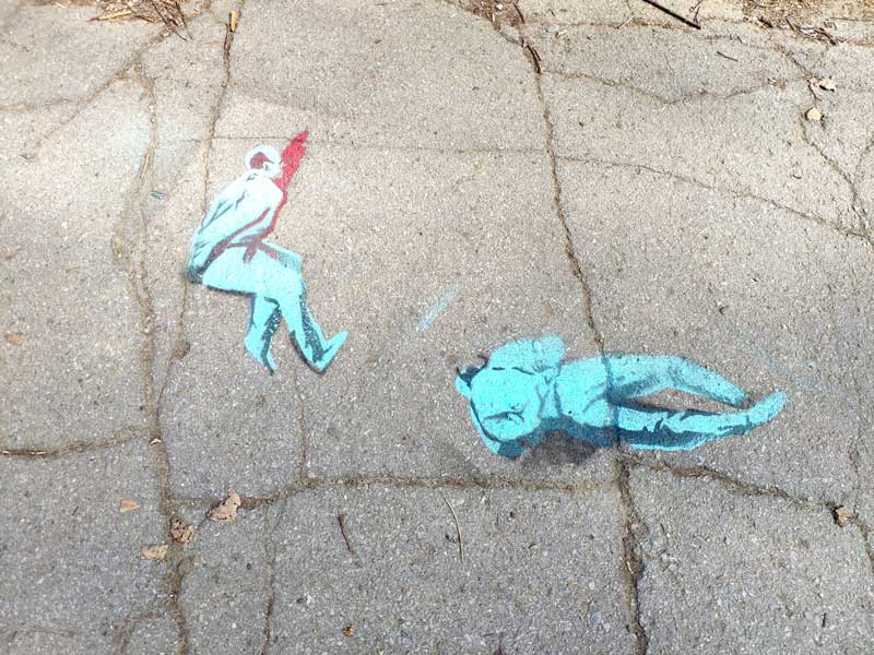 Street graffiti depicting war crimes in Bucha.