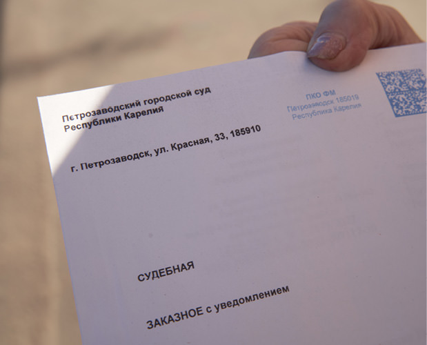 Woman holding envelope.