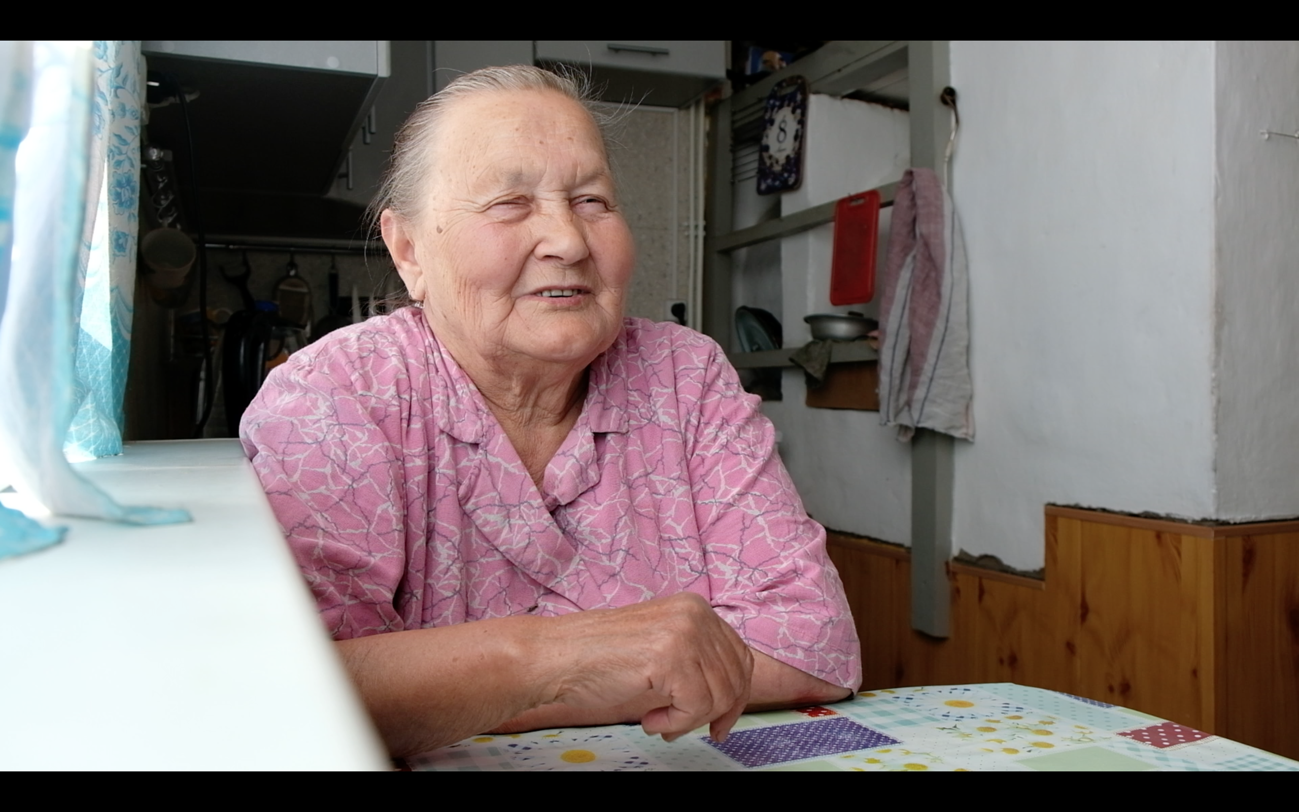 Elderly Russian village woman in interview
