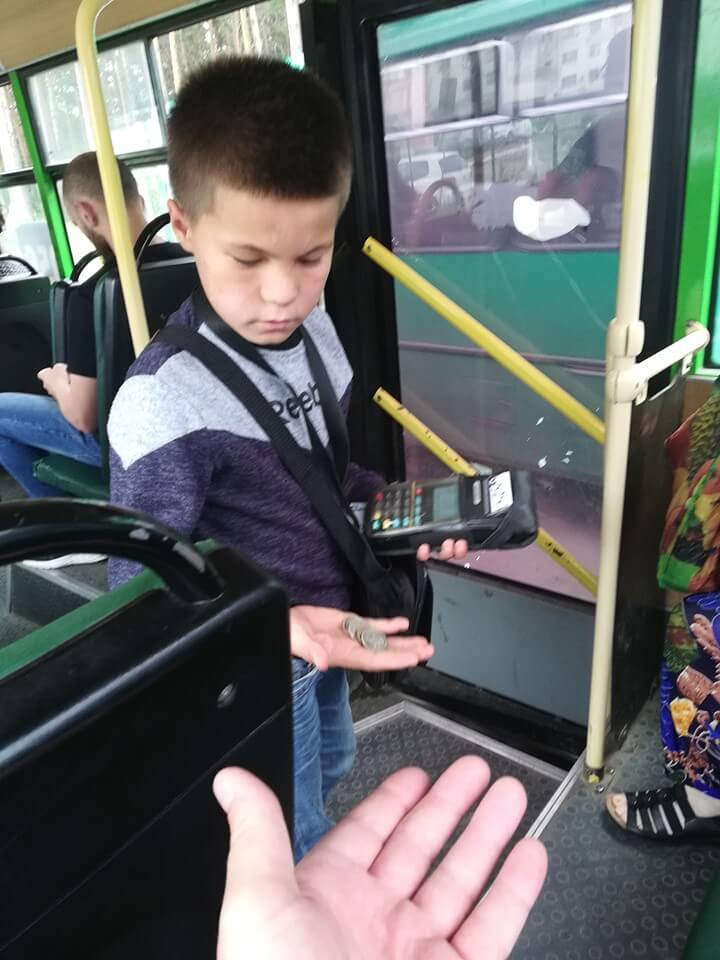 Kid conductor counting change in Russia