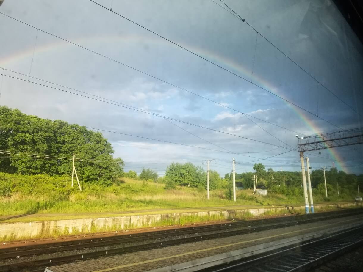 Rainbow over train tracks