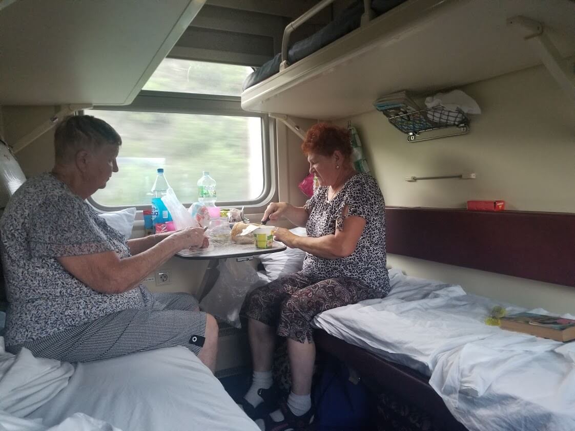 Women eating on train