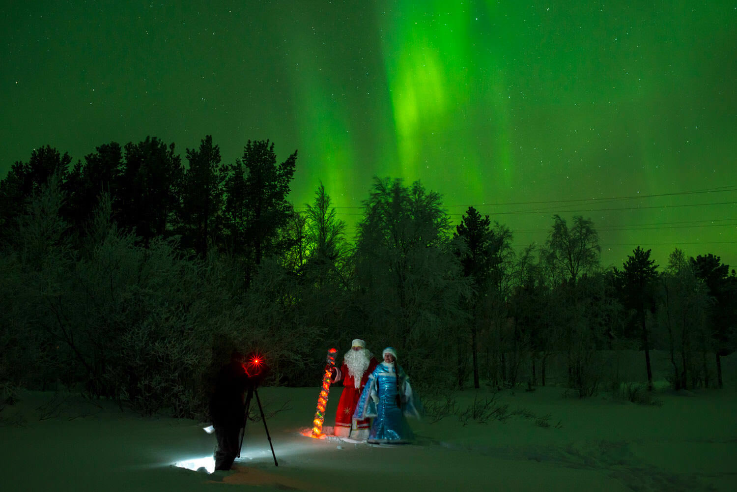 Father Frost and Snegurochka under Northern Lights