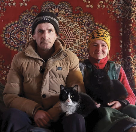 Man and woman sitting on a couch