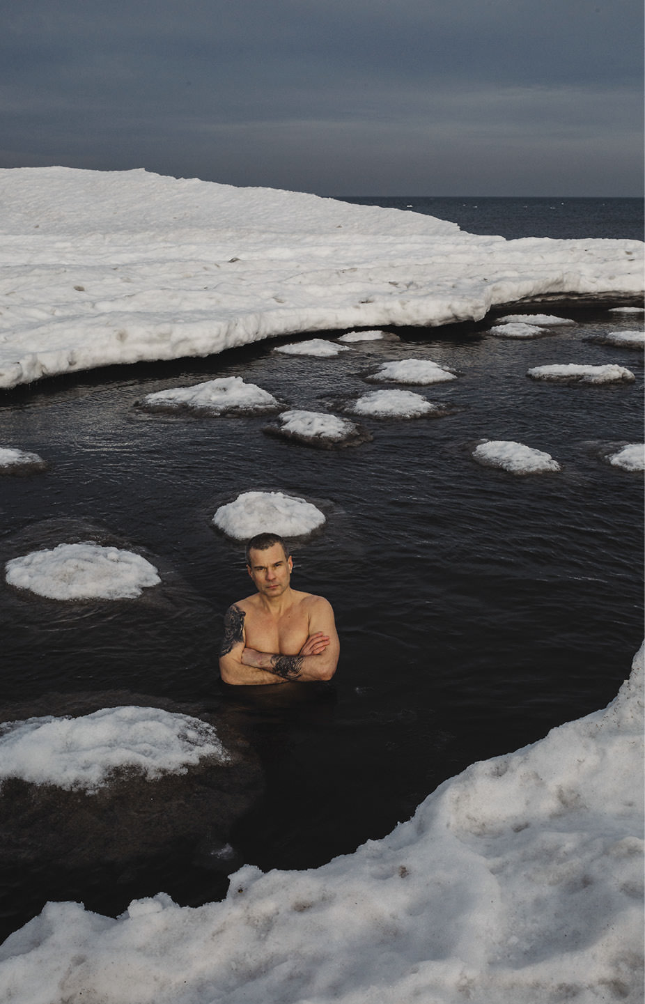 Man standing in Arctic waters.