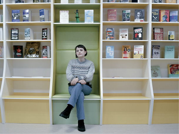Woman in classroom looking at the camera.