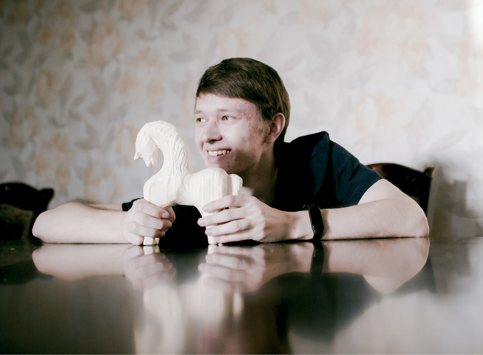 Man with carved duck.