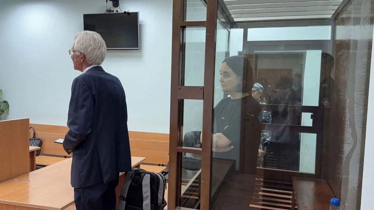 Lawyer defending political prisoner in Russian court.