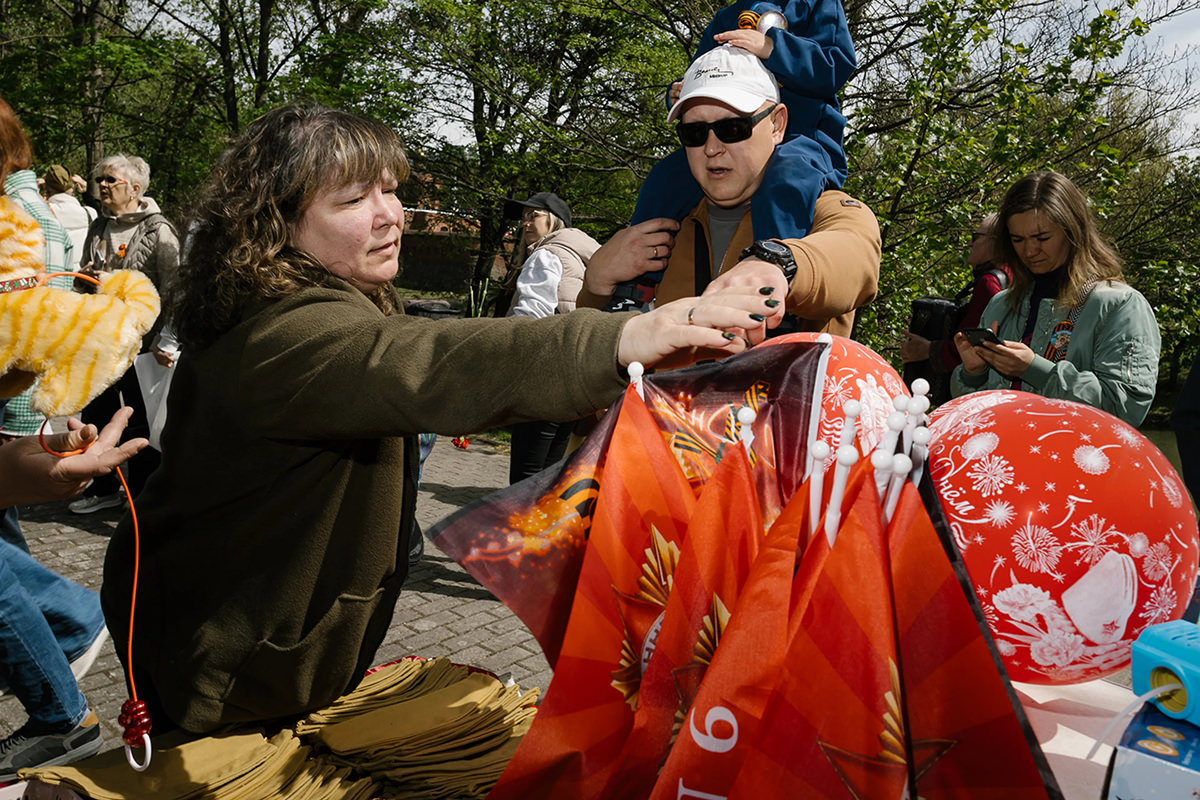 Selling flags on the street.