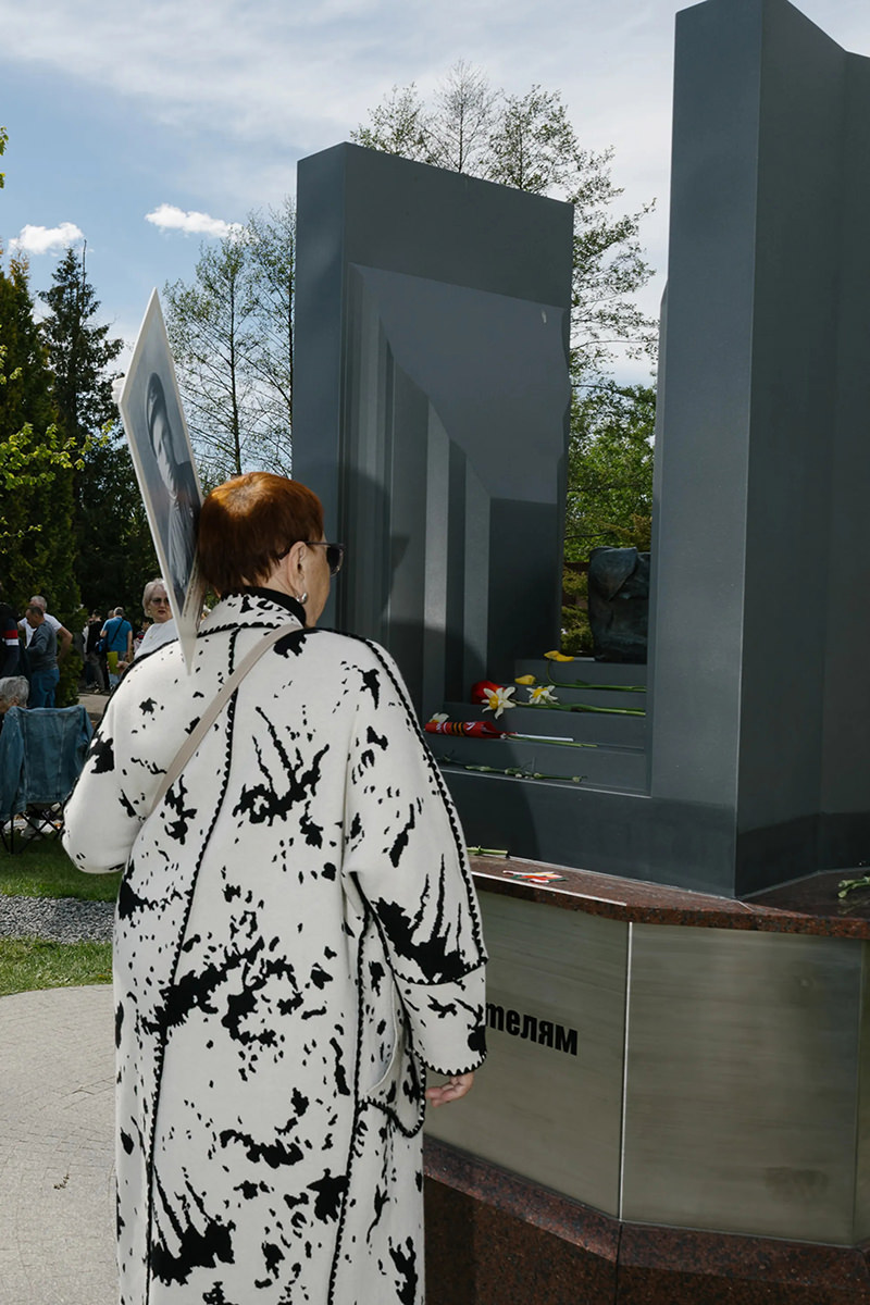Visitor looks at a monument.