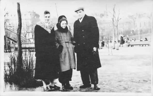 Young family looking at camera.