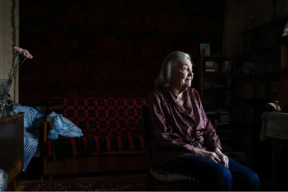 Profile photo of woman in her living room.