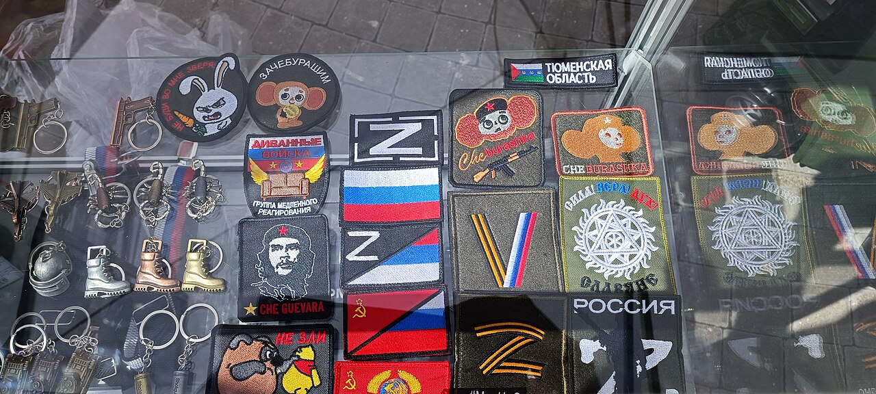 A table in a flea market showing items for sale.