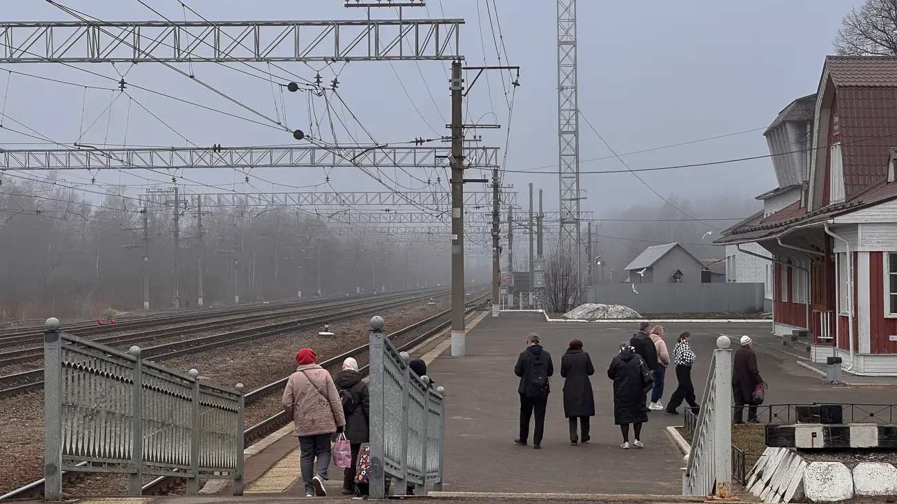 Passengers arriving at a train station.