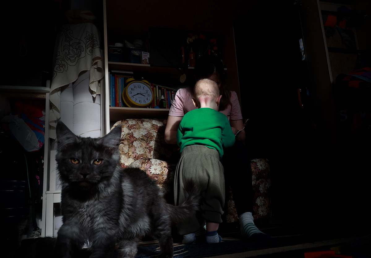 Woman with child and cat.