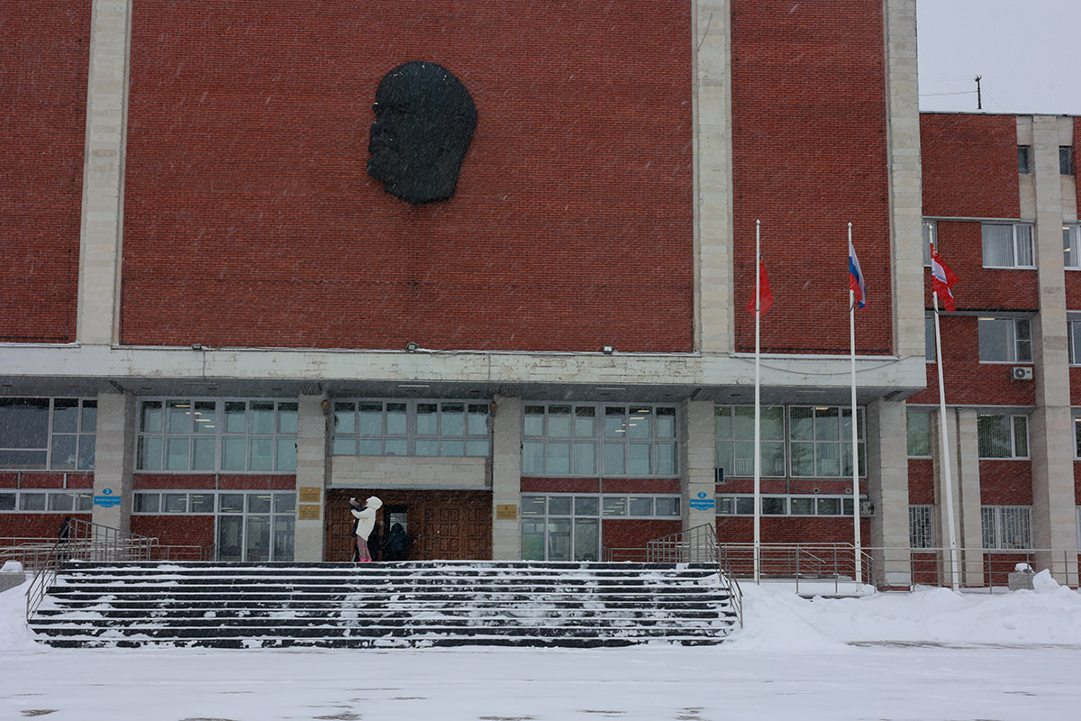 Woman outside government building.