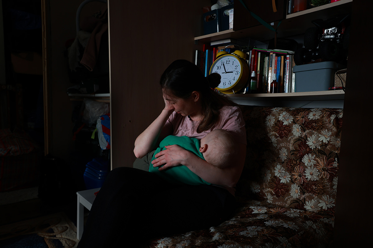 Woman holding small child.