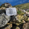 Memorial tablet and stone cairn at the highest point atop Anik Mountain.