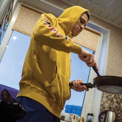 Misha making breakfast.
