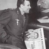 Gagarin reading a newspaper about his own spaceflight in 1961.