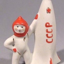 1960s porcelain figure of cosmonaut and USSR rocket.
