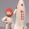 1960s porcelain figure of cosmonaut and USSR rocket.