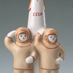 1970s porcelain figure of cosmonauts and USSR rocket.
